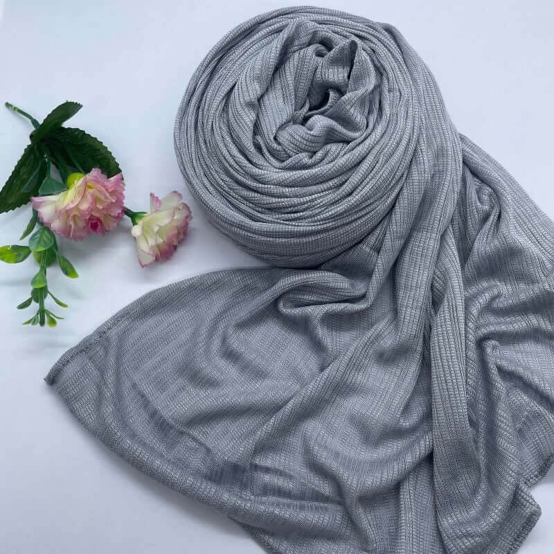 Kuwaiti Lulua Open Knit Cotton Hijab in a lightweight, breathable, and non-slip design. Soft and stretchy fabric with an airy, sheer texture, perfect for warm weather or layering. Drapes beautifully with a subtle open-knit pattern.