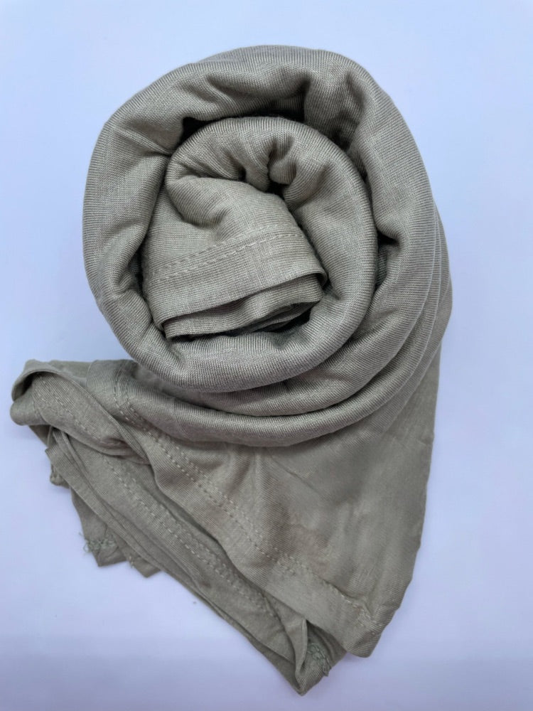 Muted green Breathable cotton hijab with a matte sheen and textured finish, perfect for everyday wear and layering