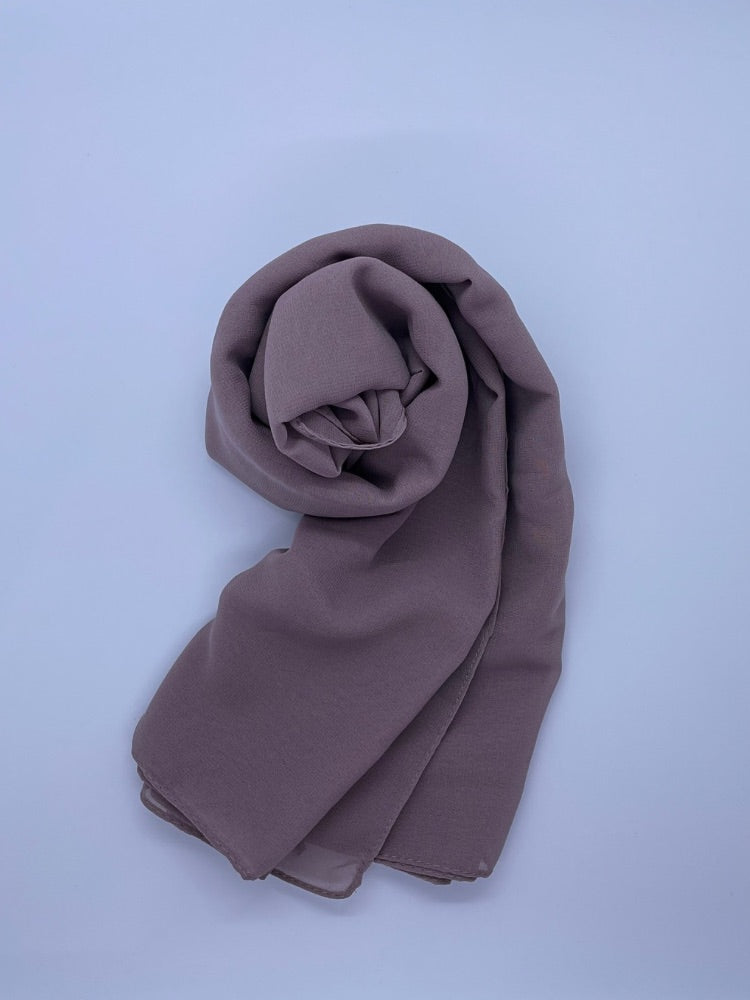 dusty purple Essential Chiffon Hijab with a semi-transparent design, secured with stylish pins, ideal for all-day comfort and versatile wear