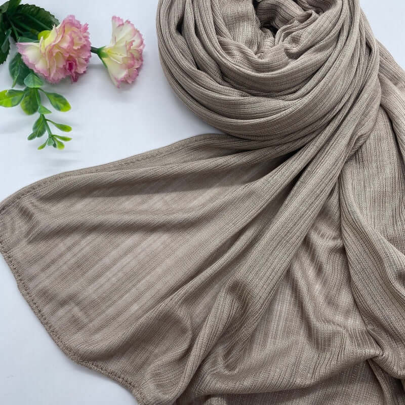 Kuwaiti Lulua Open Knit Cotton Hijab in a lightweight, breathable, and non-slip design. Soft and stretchy fabric with an airy, sheer texture, perfect for warm weather or layering. Drapes beautifully with a subtle open-knit pattern.