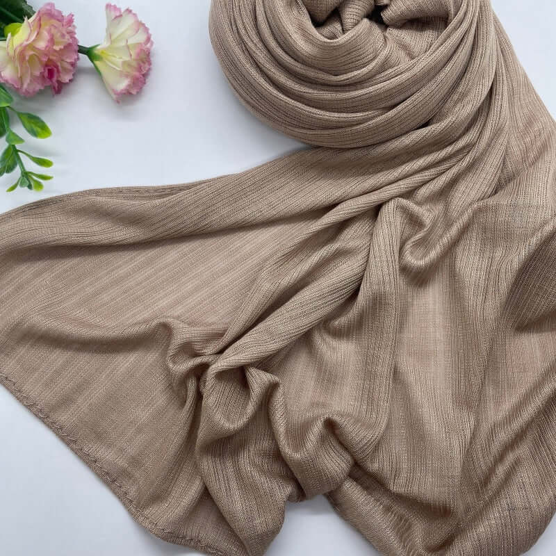 Kuwaiti Lulua Open Knit Cotton Hijab in a lightweight, breathable, and non-slip design. Soft and stretchy fabric with an airy, sheer texture, perfect for warm weather or layering. Drapes beautifully with a subtle open-knit pattern.