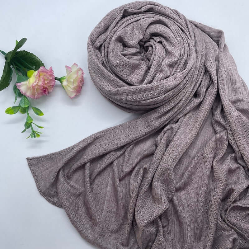Kuwaiti Lulua Open Knit Cotton Hijab in a lightweight, breathable, and non-slip design. Soft and stretchy fabric with an airy, sheer texture, perfect for warm weather or layering. Drapes beautifully with a subtle open-knit pattern.