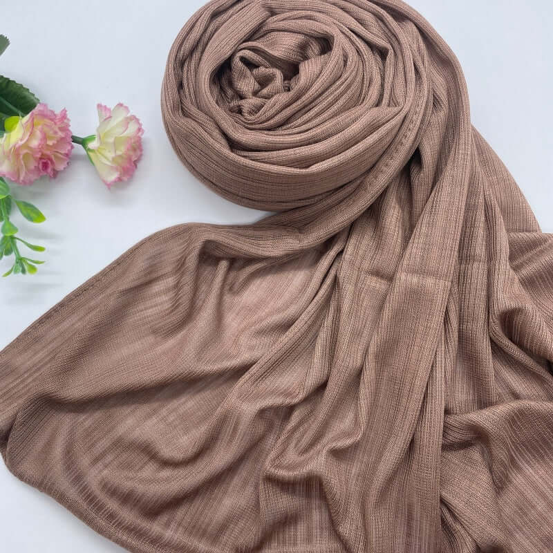 Kuwaiti Lulua Open Knit Cotton Hijab in a lightweight, breathable, and non-slip design. Soft and stretchy fabric with an airy, sheer texture, perfect for warm weather or layering. Drapes beautifully with a subtle open-knit pattern.