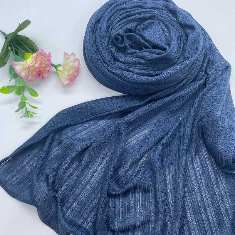 Kuwaiti Lulua Open Knit Cotton Hijab in a lightweight, breathable, and non-slip design. Soft and stretchy fabric with an airy, sheer texture, perfect for warm weather or layering. Drapes beautifully with a subtle open-knit pattern.
