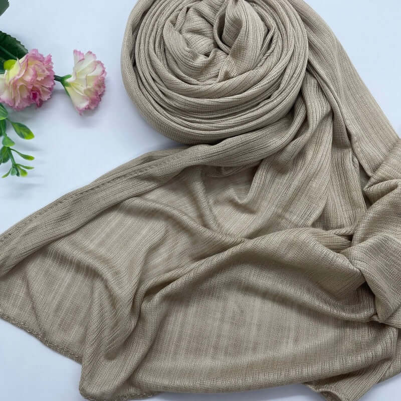Kuwaiti Lulua Open Knit Cotton Hijab in a lightweight, breathable, and non-slip design. Soft and stretchy fabric with an airy, sheer texture, perfect for warm weather or layering. Drapes beautifully with a subtle open-knit pattern.