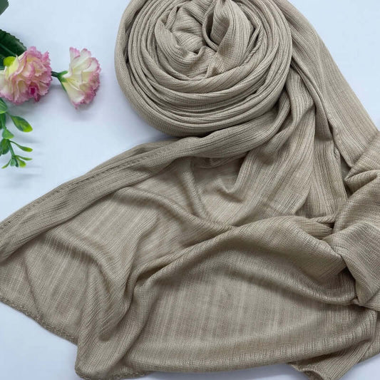 Kuwaiti Lulua Open Knit Cotton Hijab in a lightweight, breathable, and non-slip design. Soft and stretchy fabric with an airy, sheer texture, perfect for warm weather or layering. Drapes beautifully with a subtle open-knit pattern.