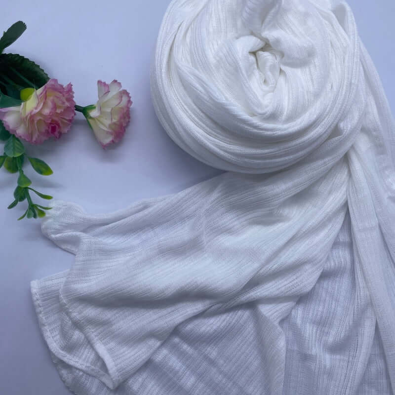 Kuwaiti Lulua Open Knit Cotton Hijab in a lightweight, breathable, and non-slip design. Soft and stretchy fabric with an airy, sheer texture, perfect for warm weather or layering. Drapes beautifully with a subtle open-knit pattern.