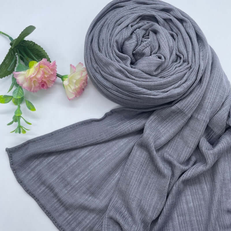 Kuwaiti Lulua Open Knit Cotton Hijab in a lightweight, breathable, and non-slip design. Soft and stretchy fabric with an airy, sheer texture, perfect for warm weather or layering. Drapes beautifully with a subtle open-knit pattern.