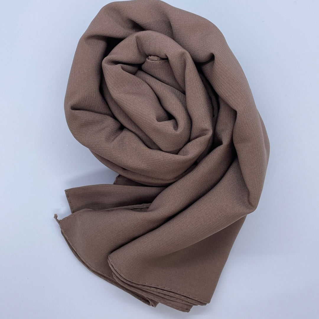 Premium Medina Silk brown Georgette hijab with soft matte finish, lightweight breathable design, and full coverage, ideal for modest fashion and everyday wear.