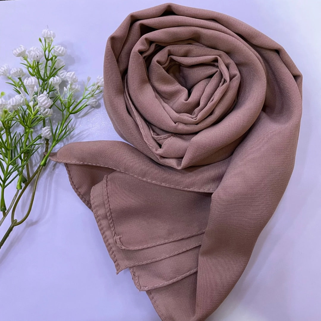 Premium Medina Silk brown Georgette hijab with soft matte finish, lightweight breathable design, and full coverage, ideal for modest fashion and everyday wear.