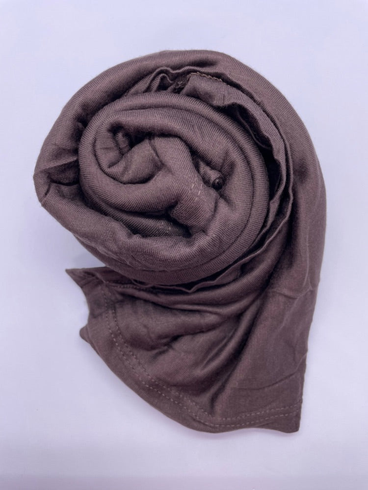 Brown coffee Breathable cotton hijab with a matte sheen and textured finish, perfect for everyday wear and layering.