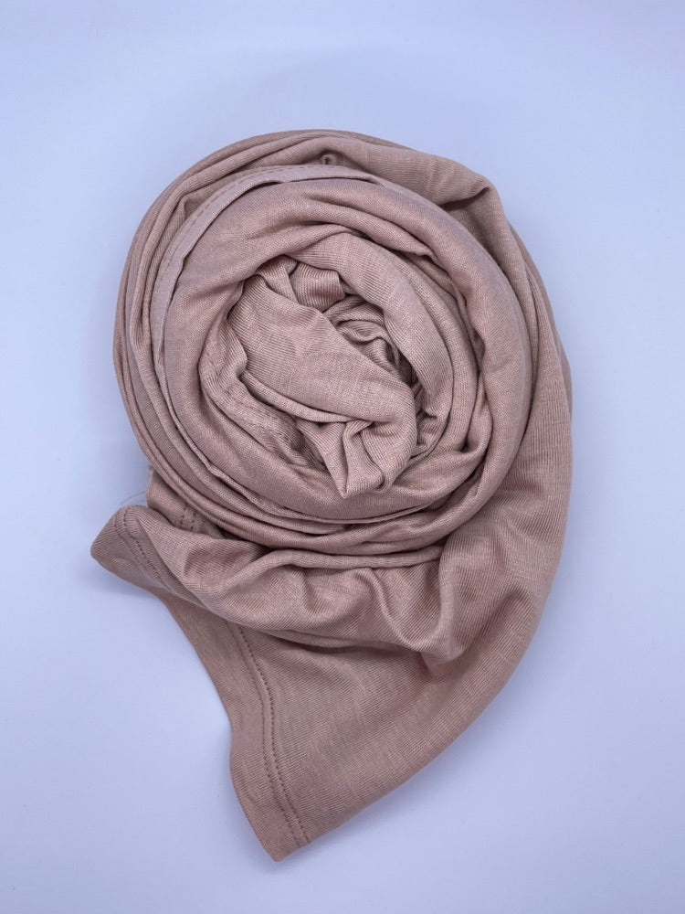 Nude pink Breathable cotton hijab with a matte sheen and textured finish, perfect for everyday wear and layering.