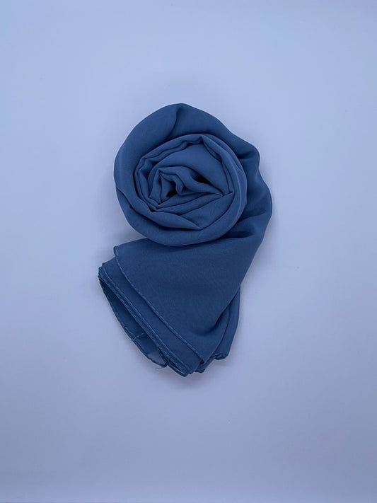 Denim Blue Essential Chiffon Hijab with a semi-transparent design, secured with stylish pins, ideal for all-day comfort and versatile wear