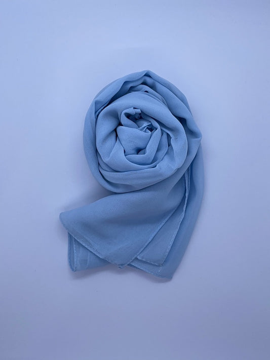 baby blue Essential Chiffon Hijab with a semi-transparent design, secured with stylish pins, ideal for all-day comfort and versatile wear