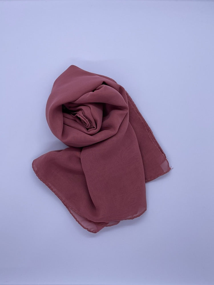 Dusky rose Essential Chiffon Hijab with a semi-transparent design, secured with stylish pins, ideal for all-day comfort and versatile wear