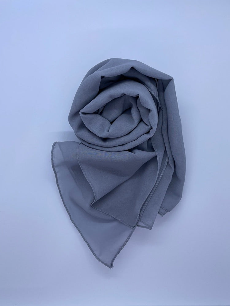 medium gray Essential Chiffon Hijab with a semi-transparent design, secured with stylish pins, ideal for all-day comfort and versatile wear