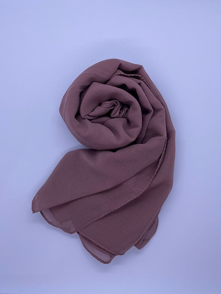 Soft plum Essential Chiffon Hijab with a semi-transparent design, secured with stylish pins, ideal for all-day comfort and versatile wear