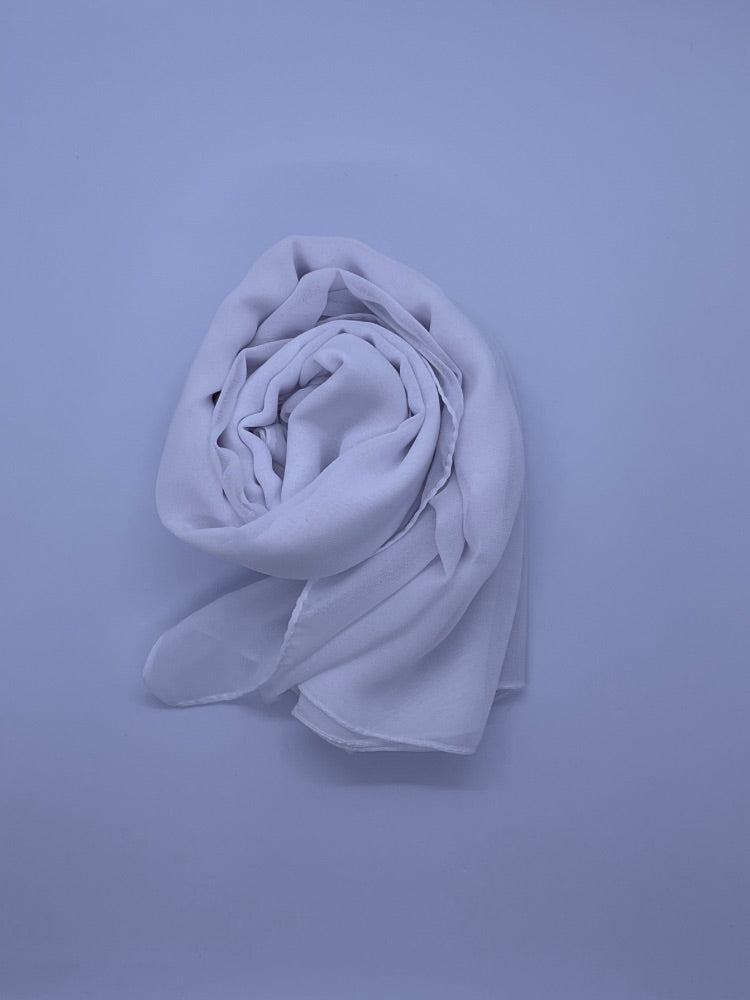 White  Essential Chiffon Hijab with a semi-transparent design, secured with stylish pins, ideal for all-day comfort and versatile wear