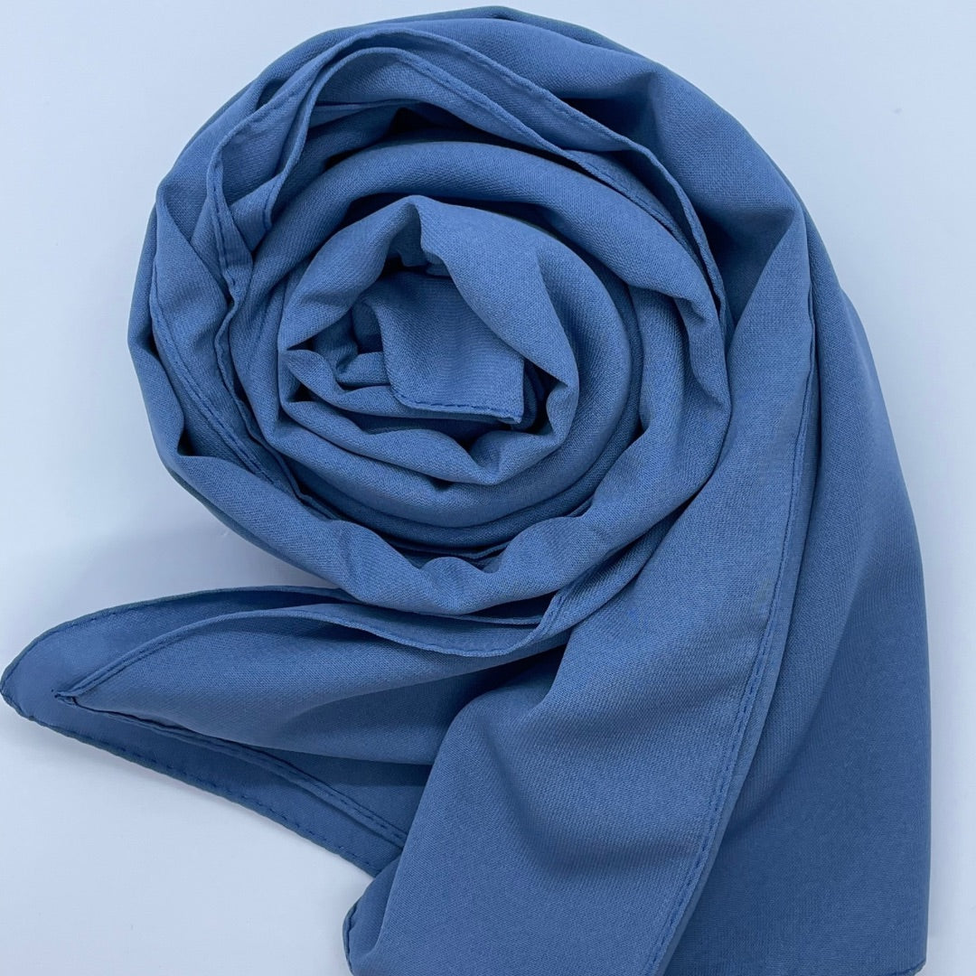 Premium Medina Silk Blue Hijab with soft matte finish, lightweight breathable design, and full coverage, ideal for modest fashion and everyday wear.