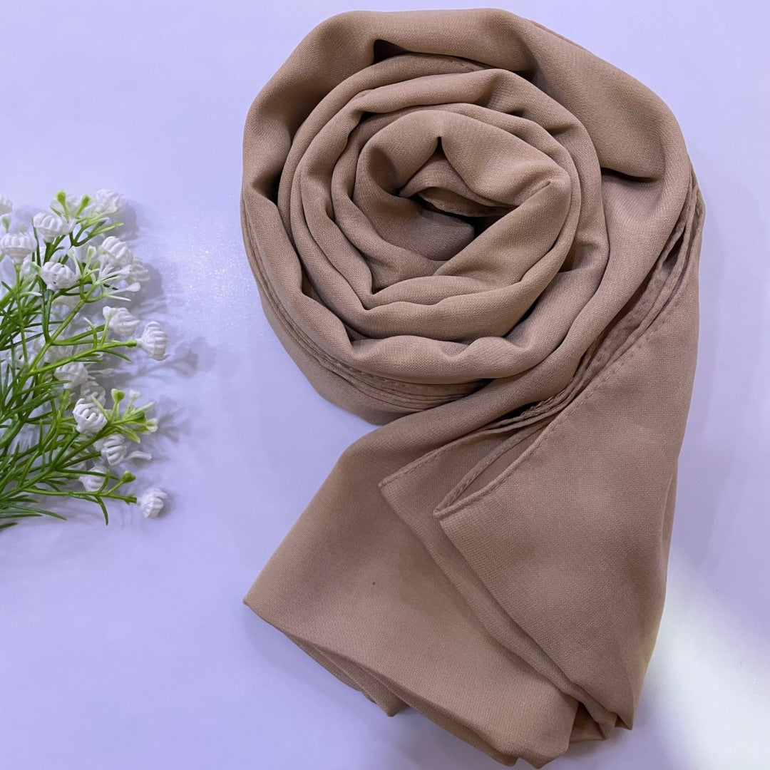 Premium Medina Silk sandy beige Hijab with soft matte finish, lightweight breathable design, and full coverage, ideal for modest fashion and everyday wear.