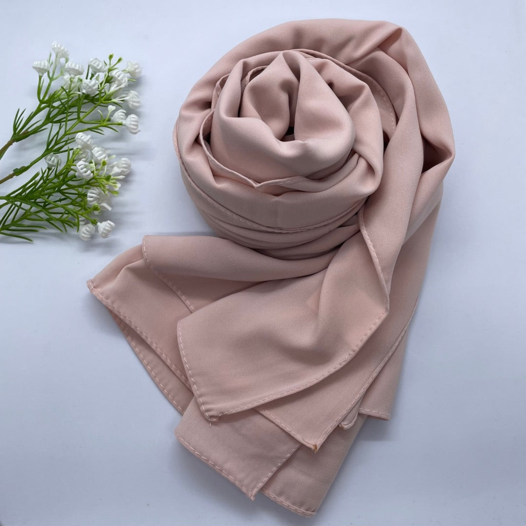 Premium Opaque soft nude Georgette Hijab with full coverage in a mid-weight, flowy fabric and matte finish. Breathable and non-slip, offering a soft drape and secure fit. Non-transparent for modesty and comfort, suitable for casual and formal wear.